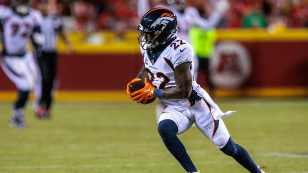 Oct 12, 2023; Kansas City, Missouri, USA; Denver Broncos safety Kareem Jackson (22) runs the ball after an interception during the second quarter against the Kansas City Chiefs at GEHA Field at Arrowhead Stadium.